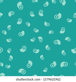 Green Human head with gear inside icon isolated seamless pattern on green background. Artificial intelligence. Thinking brain sign. Symbol work of brain.  Vector Illustration