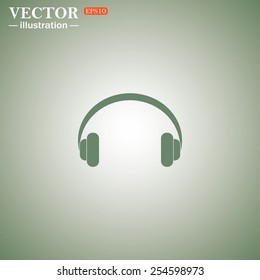 Green icon on a green background. Headphones. Musical accessory,   vector illustration, EPS 10