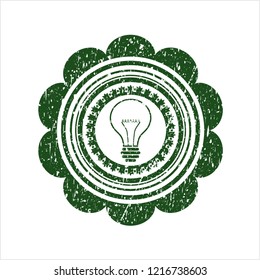 Green idea icon inside distressed rubber stamp