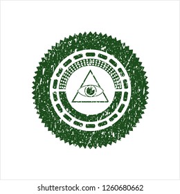 Green illuminati pyramid icon inside rubber seal with grunge texture