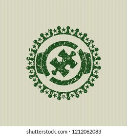 Green jigsaw puzzle piece icon inside distress rubber stamp