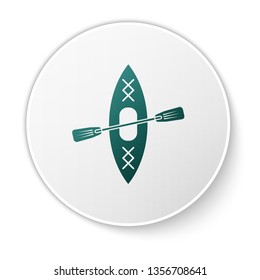 Green Kayak and paddle icon isolated on white background. Kayak and canoe for fishing and tourism. Outdoor activities. Green circle button. Vector Illustration