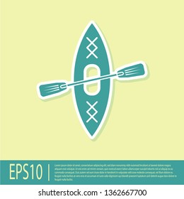 Green Kayak and paddle icon isolated on yellow background. Kayak and canoe for fishing and tourism. Outdoor activities. Flat design. Vector Illustration