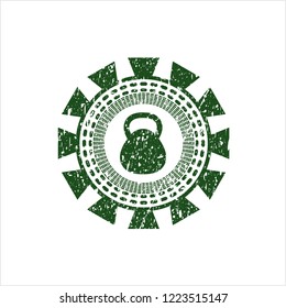 Green kettlebell icon inside distress grunge seal