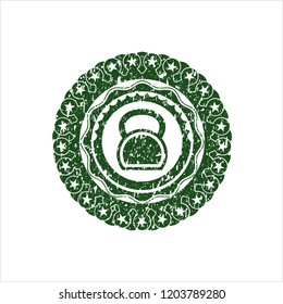 Green kettlebell icon inside distressed rubber seal