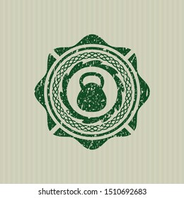 Green kettlebell icon inside distressed rubber grunge texture seal