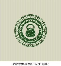 Green kettlebell icon inside rubber texture