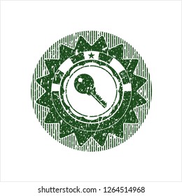 Green key icon inside distress grunge style stamp