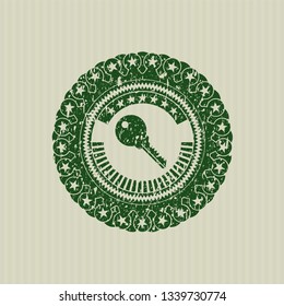 Green key icon inside distress rubber seal