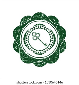 Green key icon inside distress grunge seal