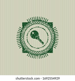 Green key icon inside distress rubber grunge texture stamp. 