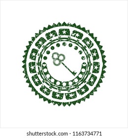 Green key icon inside rubber stamp with grunge texture