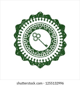 Green key icon inside rubber grunge texture seal