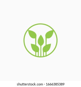 Green label concept with leaves in circle. Logo Template vector illustration design