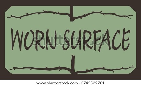Green label with worn surface text and cracked border lines creating a distressed texture