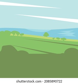 A green landscape with trees and blue sky