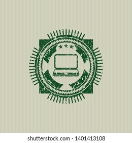 Green laptop icon inside distressed rubber grunge texture stamp