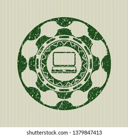 Green laptop icon inside rubber seal