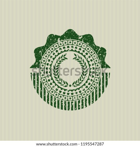Green laurel wreath icon inside rubber grunge stamp