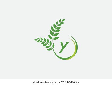 Green laurel wreath logo vector and circle icon letter and alphabets design