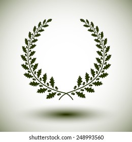 Green laurel wreath on white background.