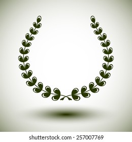 Green laurel wreath on white background.