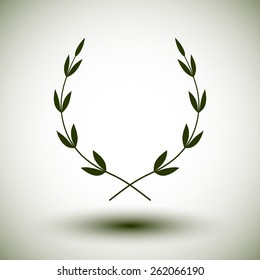 Green laurel wreath on white background.