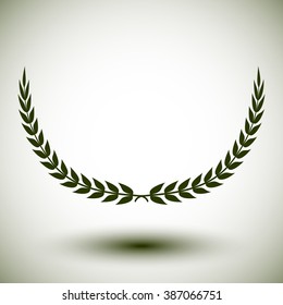 Green laurel wreath on white background.