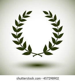 Green laurel wreath on white background.