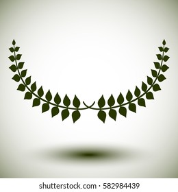 Green laurel wreath on white background.