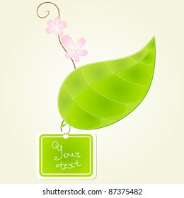 green leaf with branch and flowers on it and with label