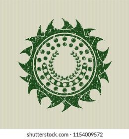 Green leaf crown icon inside distress rubber seal