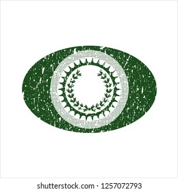 Green leaf crown icon inside distress grunge seal