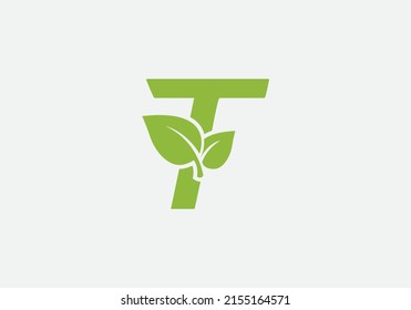 Vector de diseño de logotipo de hoja verde y naturaleza ecológica con letra T