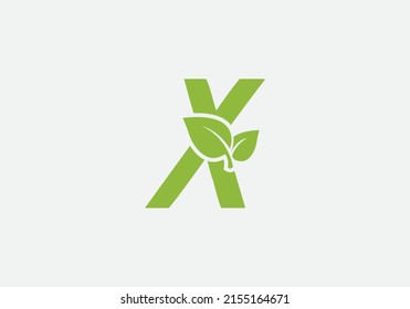 Vector de diseño de logotipo de hoja verde y naturaleza ecológica con letra X