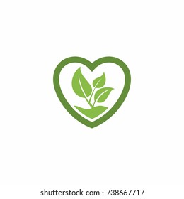 Green leaf in the love shape plant pot logo.