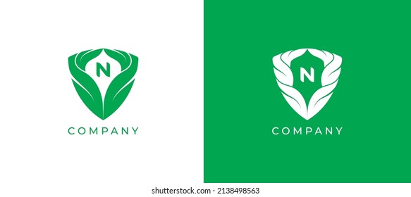 Green Leaf and Shield Logo sign icon symbol Design with Letter N. Vector illustration logo template