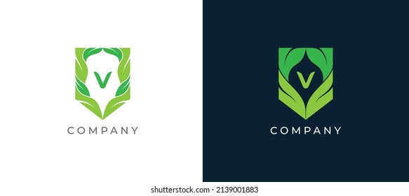 Green Leaf and Shield Logo sign icon symbol Design with Letter V. Vector illustration logo template