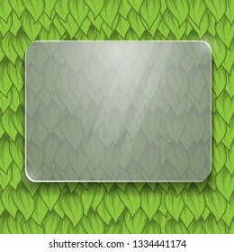 Green leaves background with empty glass frame