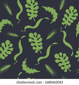 green leaves of plants on a dark background