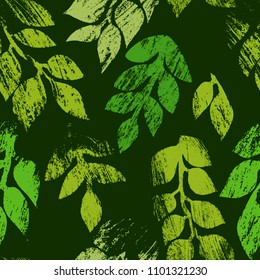 Green leaves printed on dark nature seamless pattern, vector