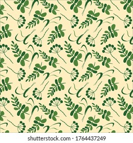 Green leaves seamless pattern design on light yellow background