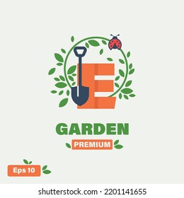 Green letter E logo with leaves. Symbol of nature, gardens, florists, health and natural beauty.