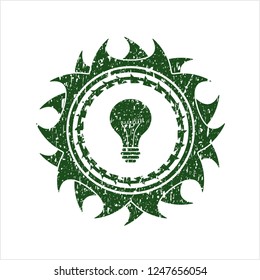Green light bulb icon inside distress rubber grunge texture stamp