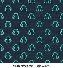 Green line Headphones icon isolated seamless pattern on blue background. Earphones. Concept for listening to music, service, communication and operator.  Vector
