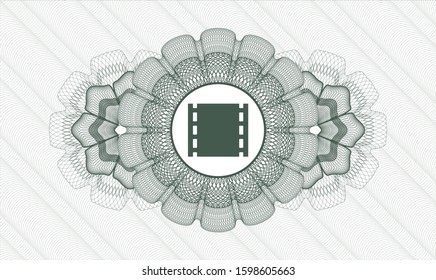 Green linear rosette with film icon inside