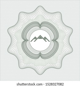 Green linear rosette with mountain icon inside