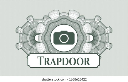 Grüner Linearrosett mit Fotokamerasymbol und Trapdoor-Text im Inneren