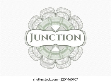 Green linear rosette with text Junction inside