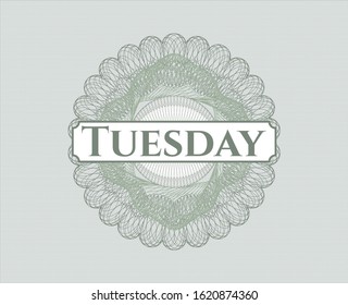 Green linear rosette with text Tuesday inside